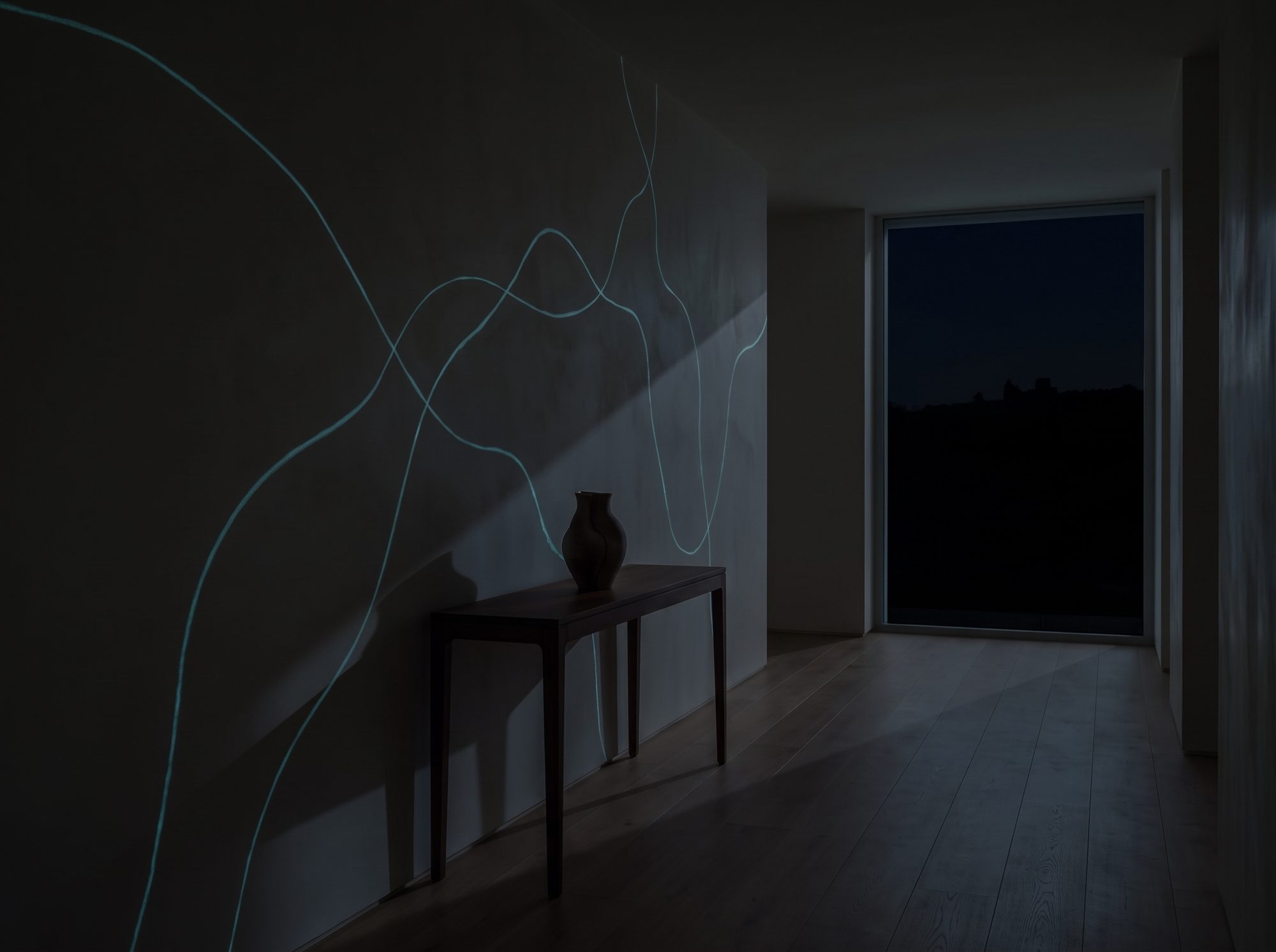 Visualisation: the same wall at night, the line pattern glowing blue-green